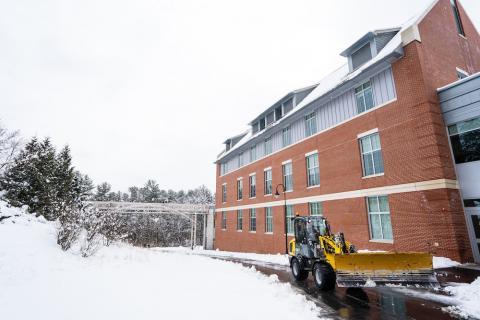 construction vehicle on campus during the winter